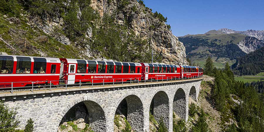 Journeying on the Bernina Express in First Class across the Alps to Italy