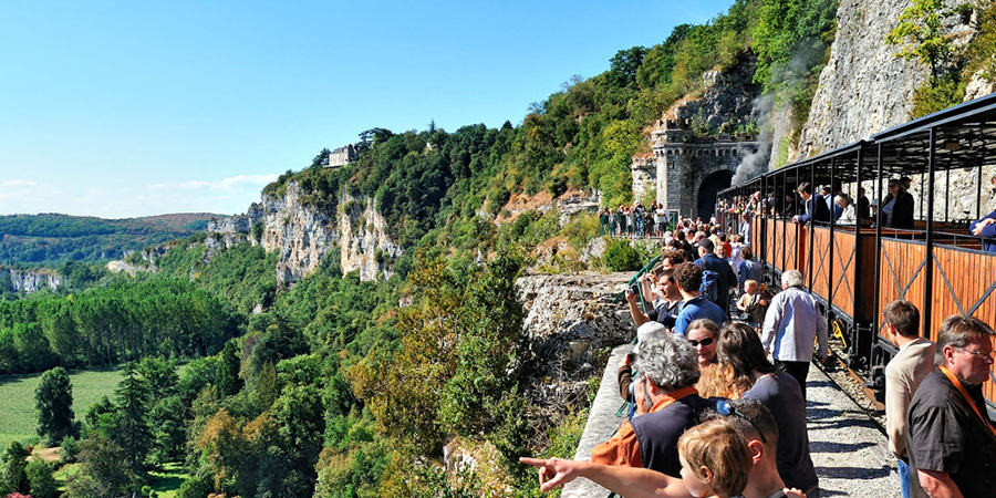 Riding the open carriages of the Truffadou Steam Train